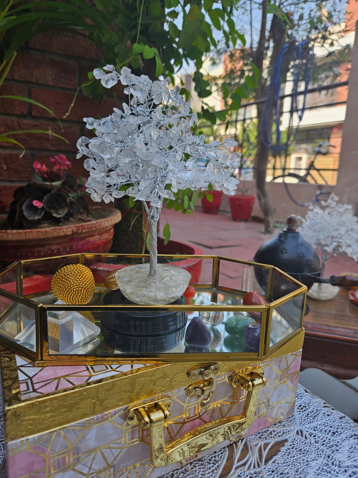 Clear quartz crystal tree on an orgonite base from Mihika Sugandham