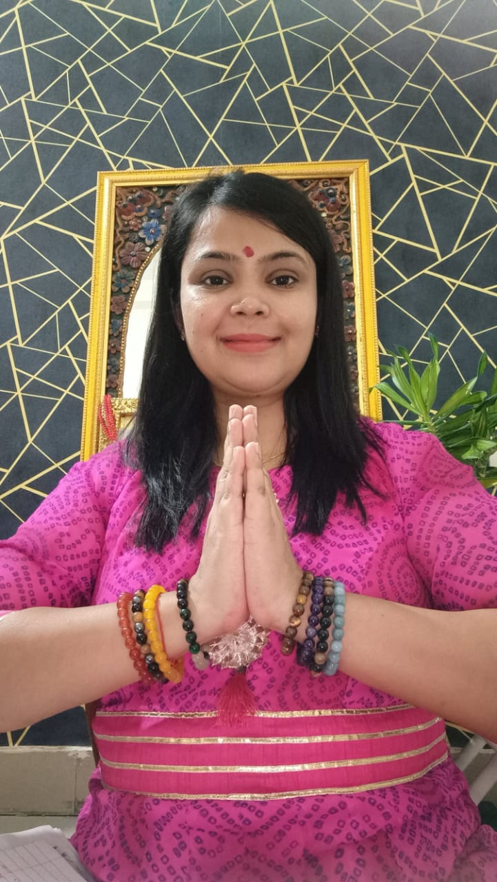 Healer Aannchal Jain Garg greeting with namaste and crystal bracelets